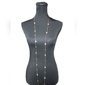 Longer gold plated necklace with redish brown, silverish gold, and gold beads